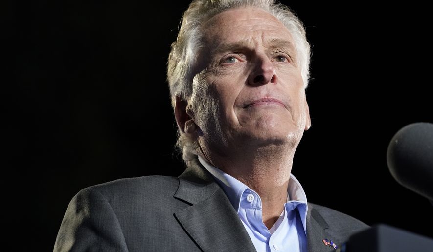 Democratic gubernatorial candidate former Virginia Gov. Terry McAuliffe pauses as he speaks during a rally Tuesday, Oct. 26, 2021, in Arlington, Va. McAuliffe will face Republican Glenn Youngkin in the November election. (AP Photo/Alex Brandon)