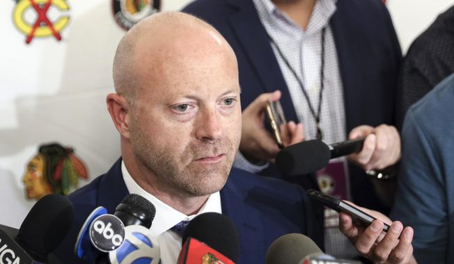 In this July 26, 2019, file photo, Chicago Blackhawks senior vice president and general manager Stan Bowman speaks to the media during the NHL hockey team&#x27;s convention in Chicago. Bowman resigned Tuesday, Oct. 26, 2021, following an investigation into allegations that an assistant coach sexually assaulted a player in 2010. (AP Photo/Amr Alfiky, File) **FILE**