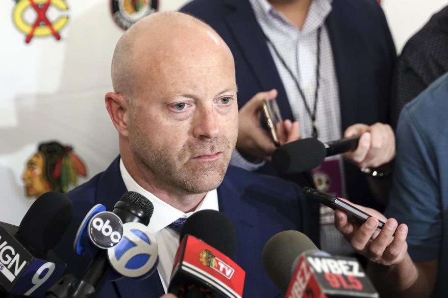 In this July 26, 2019, file photo, Chicago Blackhawks senior vice president and general manager Stan Bowman speaks to the media during the NHL hockey team&#39;s convention in Chicago. Bowman resigned Tuesday, Oct. 26, 2021, following an investigation into allegations that an assistant coach sexually assaulted a player in 2010. (AP Photo/Amr Alfiky, File) **FILE**