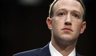 In this April 10, 2018, file photo, Facebook CEO Mark Zuckerberg testifies before a joint hearing of the Commerce and Judiciary Committees on Capitol Hill in Washington. Last spring, as false claims about vaccine safety threatened to undermine the world&#39;s response to COVID-19, researchers at Facebook wrote that they could reduce vaccine misinformation by tweaking how vaccine posts show up on users&#39; newsfeeds, or by turning off comments entirely. Yet despite internal documents showing these changes worked, Facebook was slow to take action. (AP Photo/Alex Brandon, File)