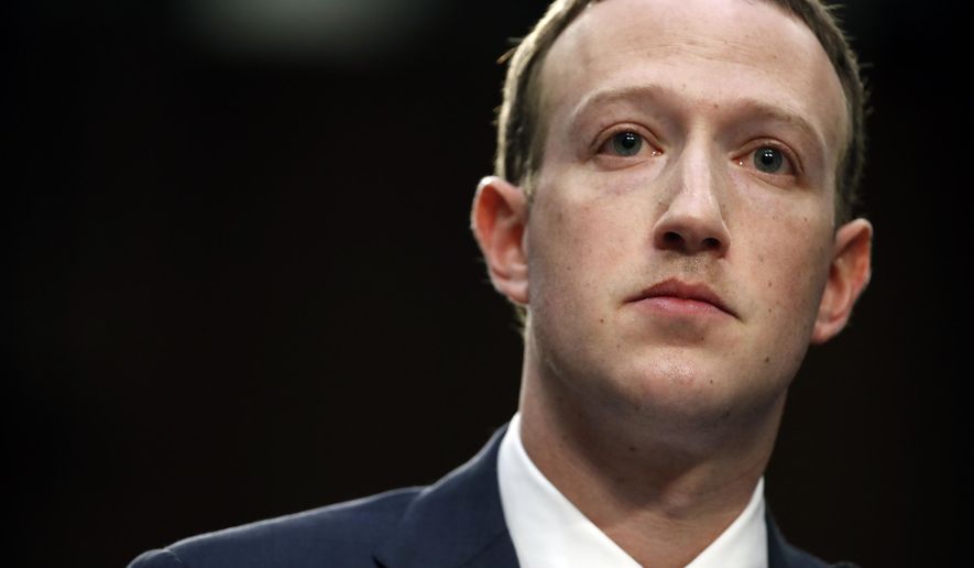 In this April 10, 2018, file photo, Facebook CEO Mark Zuckerberg testifies before a joint hearing of the Commerce and Judiciary Committees on Capitol Hill in Washington. Last spring, as false claims about vaccine safety threatened to undermine the world&#x27;s response to COVID-19, researchers at Facebook wrote that they could reduce vaccine misinformation by tweaking how vaccine posts show up on users&#x27; newsfeeds, or by turning off comments entirely. Yet despite internal documents showing these changes worked, Facebook was slow to take action. (AP Photo/Alex Brandon, File)