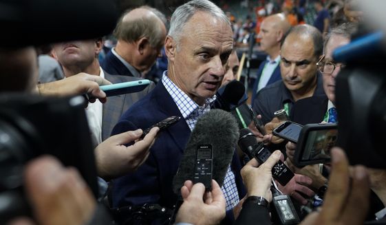 Commissioner of Major League Baseball. Robert D. Manfred, Jr. talks with the media before Game 1 in baseball&#39;s World Series between the Houston Astros and the Atlanta Braves Tuesday, Oct. 26, 2021, in Houston. (AP Photo/David J. Phillip)