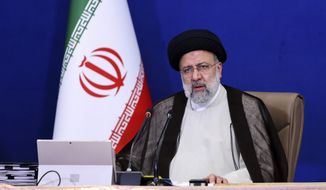 In this photo released by the official website of the office of the Iranian Presidency, President Ebrahim Raisi speaks during a cabinet meeting in Tehran, Iran, Wednesday, Oct. 27, 2021. Raisi said Wednesday that a cyberattack which paralyzed every gas station in the Islamic Republic was designed to get &quot;people angry by creating disorder and disruption,&quot; as long lines still snaked around the pumps a day after the incident began. (Iranian Presidency Office via AP)