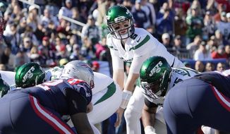New York Jets quarterback Mike White (5) on the line of scrimmage, after replacing Jack Wilson, during the first half of an NFL football game against the New England Patriots, Sunday, Oct. 24, 2021, in Foxborough, Mass. (AP Photo/Mary Schwalm) **FILE**