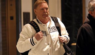 Mark Davis, owner of the Las Vegas Raiders, leaves the NFL owners meeting in New York, Wednesday, Oct. 27, 2021. (AP Photo/Adam Hunger)