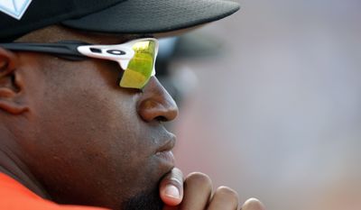 Baltimore Orioles outfielder Eric young Jr., looks on from the dugout a spring training baseball game against the Minnesota Twins Monday, March 4, 2019, in Fort Myers, Fla. (AP Photo/John Bazemore)