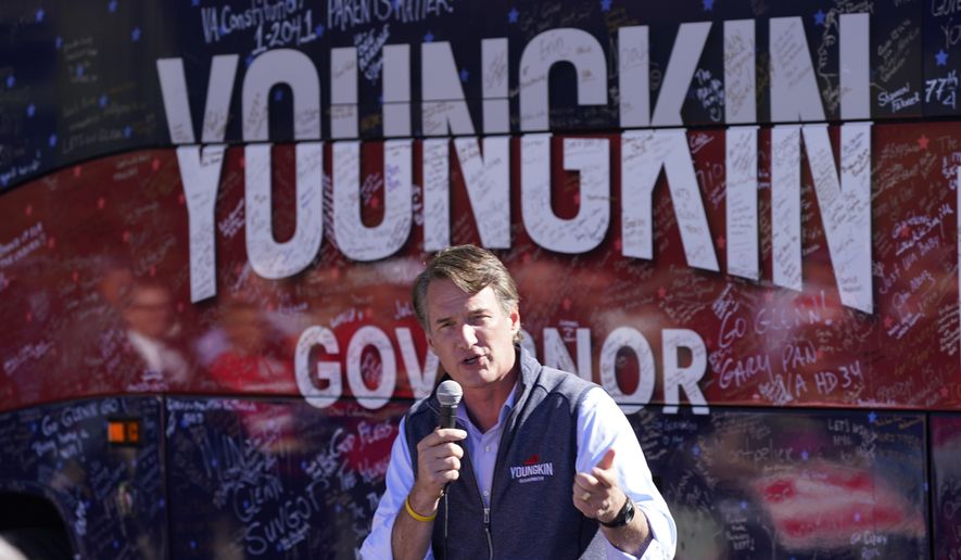 Republican gubernatorial candidate Glenn Youngkin speaks during a rally in Roanoke, Va., Wednesday, Oct. 27, 2021. Youngkin will face Democrat Terry McAuliffe in the November election and has been aggressively courting the Latino vote by stoking an anti-socialism message, capturing nearly half of the Hispanic vote in a recent poll. (AP Photo/Steve Helber)