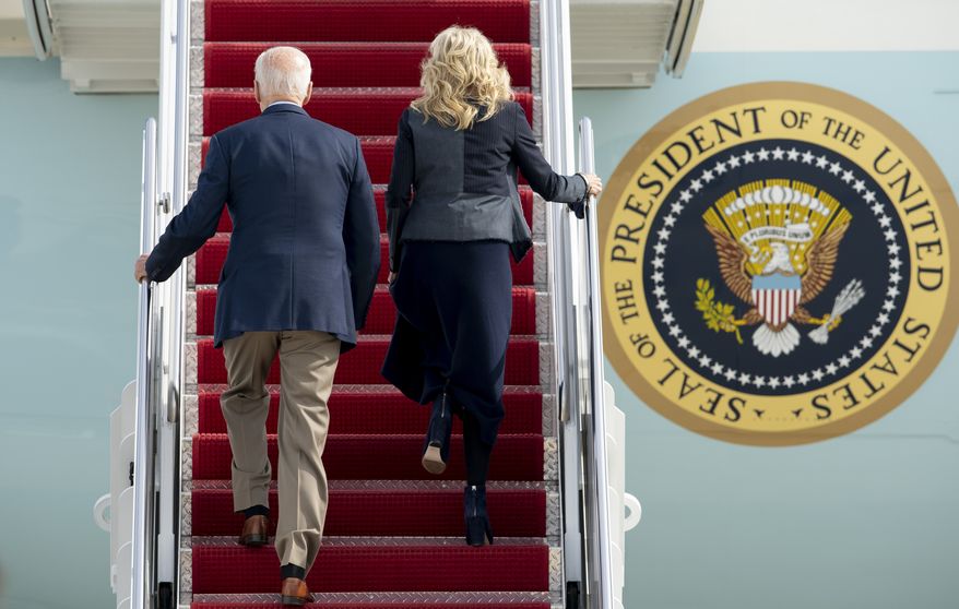 President Joe Biden and first lady Jill Biden board Air Force One, Thursday, Oct. 28, 2021, at Andrews Air Force Base, Md. The Biden are en route to Rome to attend the G-20 meeting. (AP Photo/Gemunu Amarasinghe)