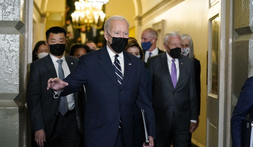 President Joe Biden walks in a basement hallway of the Capitol to meet with House Democrats, on Capitol Hill Washington, Thursday, Oct. 28th, 2021. (AP Photo/Andrew Harnik)