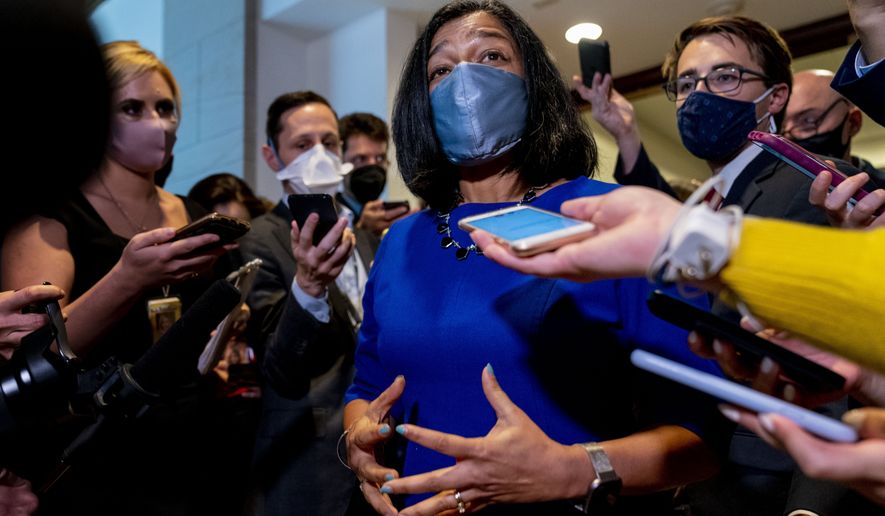 Rep. Pramila Jayapal, D-Wash., speaks to reporters as she walks out of a House Democratic Progressive Caucus meeting on Capitol Hill in Washington, Thursday, Oct. 28, 2021. (AP Photo/Andrew Harnik)