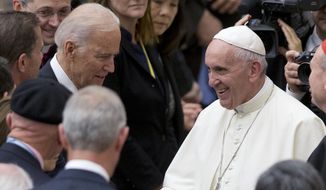 In this April 29, 2016, photo, Pope Francis shakes hands with U.S. Vice President Joe Biden as he takes part in a congress on the progress of regenerative medicine and its cultural impact, being held in the Pope Paul VI hall at the Vatican. President Joe Biden is scheduled to meet with Pope Francis on Friday, Oct. 29, 2021. (AP Photo/Andrew Medichini) **FILE**