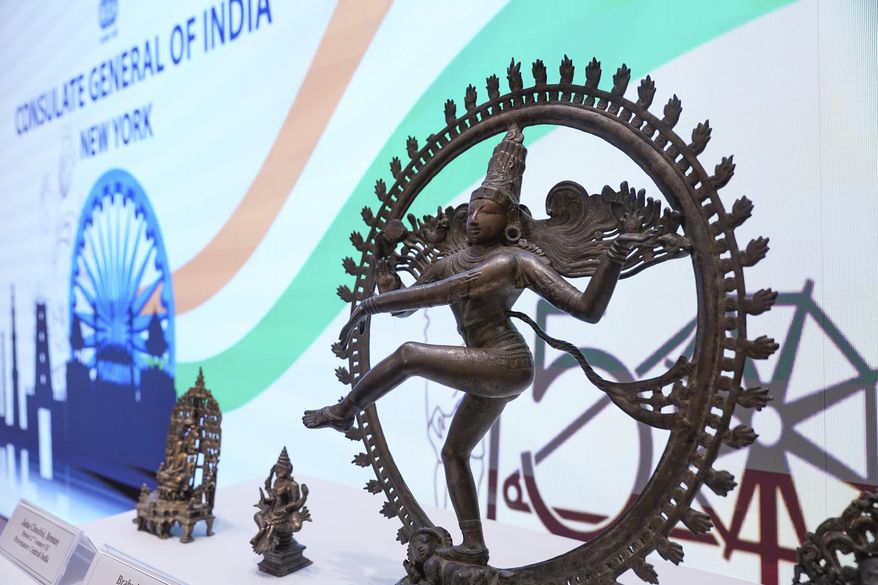 Some of the stolen objects being returned to India, including this bronze Shiva Nataraja valued at $4 million, are displayed during a ceremony at the Indian consulate in New York, Thursday, Oct. 28, 2021. U.S. authorities have returned about 250 antiquities to India in a long-running investigation of a stolen art scheme. The items, worth an estimated $15 million, were handed over on Thursday during a ceremony at the Indian consulate in New York City. (AP Photo/Seth Wenig)
