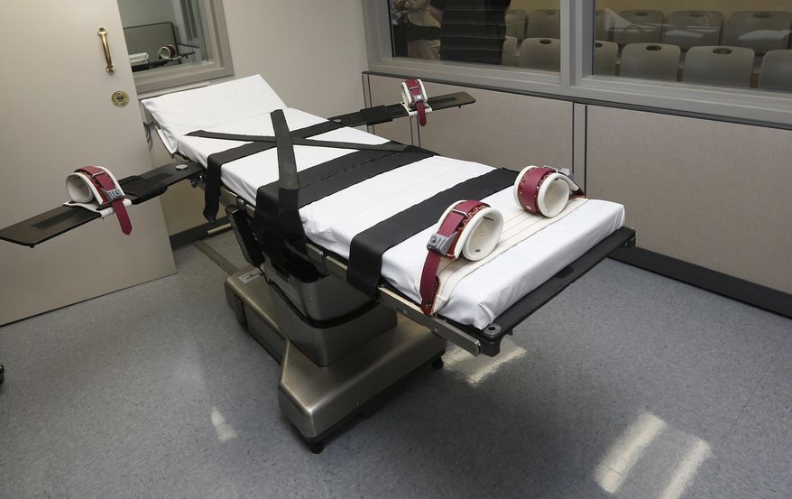 FILE - This Oct. 9, 2014, file photo shows the gurney in the the execution chamber at the Oklahoma State Penitentiary in McAlester, Okla. A 60-year-old Oklahoma man who stabbed a prison cafeteria worker to death in 1998 is scheduled to receive a lethal injection Thursday, Oct. 28, 2021 in the state&#39;s first attempt to administer the death penalty since a series of flawed executions more than six years ago. The state was moving forward with John Marion Grant&#39;s lethal injection after the U.S. Supreme Court, in a 5-3 decision, lifted stays of execution that were put in place on Wednesday for Grant and another death row inmate, Julius Jones, by the 10th U.S. Circuit Court of Appeals. (AP Photo/Sue Ogrocki, File)