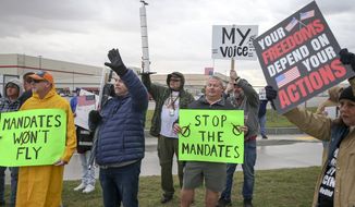 Protesters hold up signs and cheer at traffic outside of American Airlines Maintenance Facility while protesting COVID-19 vaccine mandates on Thursday, Oct. 28, 2021, in Tulsa, Okla. (Ian Maule /Tulsa World via AP) ** FILE **