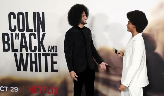 Colin Kaepernick, left, co-creator of the Netflix dramatic limited series &quot;Colin in Black and White,&quot; greets cast member Jaden Michael at the premiere of the series Thursday, Oct. 28, 2021, at the Academy Museum of Motion Pictures in Los Angeles. Michael portrays Kaepernick in the series. (AP Photo/Chris Pizzello)
