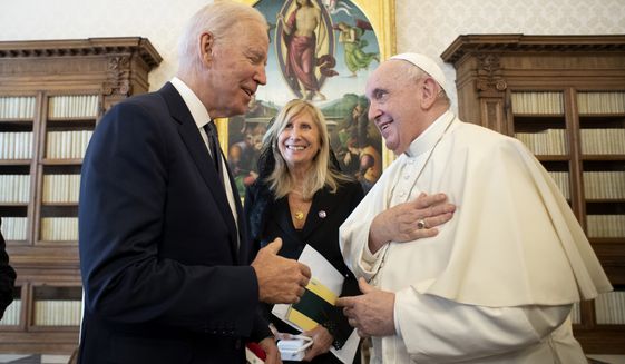 US President Joe Biden, left, talks to Pope Francis as they meet at the Vatican, Friday, Oct. 29, 2021. President Joe Biden met with Pope Francis on Friday at the Vatican, where the worlds two most notable Roman Catholics plan to discuss the COVID-19 pandemic, climate change and poverty. The president takes pride in his Catholic faith, using it as moral guidepost to shape many of his social and economic policies. (Vatican Media via AP)
