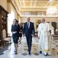 US President Joe Biden, first lady Jill Biden and Pope Francis walk as they meet at the Vatican, Friday, Oct. 29, 2021. President Joe Biden is set to meet with Pope Francis on Friday at the Vatican, where the worlds two most notable Roman Catholics plan to discuss the COVID-19 pandemic, climate change and poverty. The president takes pride in his Catholic faith, using it as moral guidepost to shape many of his social and economic policies. (Vatican Media via AP)