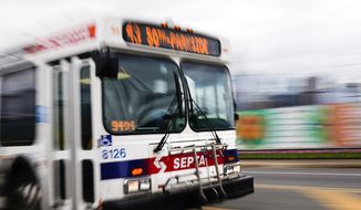 A Southeastern Pennsylvania Transportation Authority (SEPTA) bus is driven in Philadelphia, in this file photo from, Oct. 27, 2021. Members of Philadelphia&#39;s largest transit worker&#39;s union announced early Friday, Oct. 29, 2021 they reached a tentative contract agreement. The agreement has averted a possible strike that threatened to bring elevated trains, buses and trolleys to a halt and leave thousands of children and educators without a way to get to school next week. (AP Photo/Matt Rourke, File)