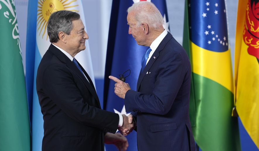 U.S. President Joe Biden, right, speaks with Italy&#39;s Prime Minister Mario Draghi as he arrives at the La Nuvola conference center for the G20 summit in Rome, Saturday, Oct. 30, 2021. The two-day Group of 20 summit is the first in-person gathering of leaders of the world&#39;s biggest economies since the COVID-19 pandemic started. (AP Photo/Domenico Stinellis)