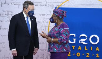World Trade Organization President Ngozi Okonjo-Iweala, right, is greeted by Italy&#39;s Prime Minister Mario Draghi during arrivals at the La Nuvola conference center for the G20 summit in Rome, Saturday, Oct. 30, 2021. The two-day Group of 20 summit is the first in-person gathering of leaders of the world&#39;s biggest economies since the COVID-19 pandemic started. (AP Photo/Domenico Stinellis)