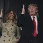 Former President Donald Trump and his wife Melania perform the tomahawk chop before Game 4 of baseball&#39;s World Series between the Houston Astros and the Atlanta Braves Saturday, Oct. 30, 2021, in Atlanta. (AP Photo/David J. Phillip)