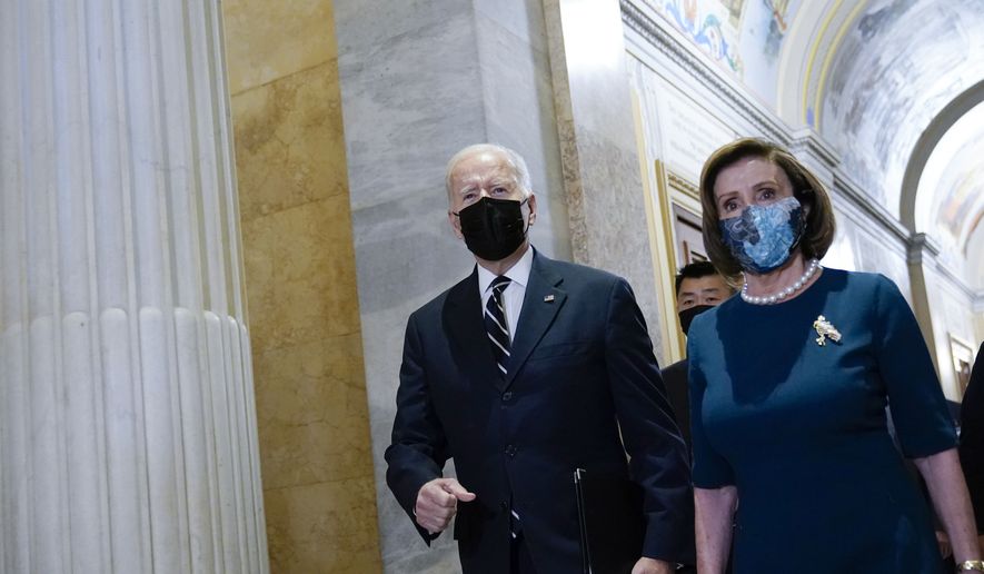 President Biden walks with House Speaker Nancy Pelosi of Calif., as he arrives on Capitol Hill in Washington, Oct. 28, 2021, for a meeting with House Democrats. Though its final shape is still being negotiated, Biden bowed to Democrats&#39; handful of stubborn moderates demanding that he cut his 10-year, $3.5 trillion package of social and environment programs in half. (AP Photo/Susan Walsh) **FILE**