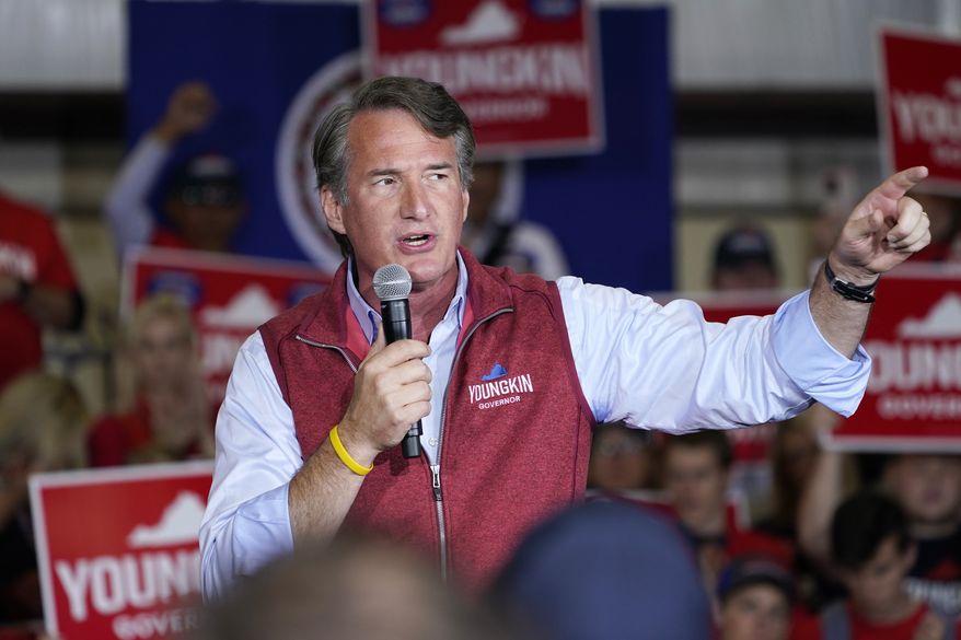 Republican gubernatorial candidate Glenn Youngkin gestures as he speaks to supporters during a rally in Chesterfield, Va., Monday, Nov. 1, 2021. Youngkin will face Democrat former Gov. Terry McAuliffe in the November election. (AP Photo/Steve Helber)