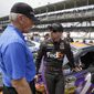 NASCAR team owner Joe Gibbs, left, talks with Denny Hamlin before the Brickyard 400 auto race at Indianapolis Motor Speedway in Indianapolis, July 27, 2014. Long recognized alongside Mark Martin as the greatest NASCAR driver to never win a championship, Hamlin has a fifth try Sunday to at long last grab that elusive Cup title.  (AP Photo/Darron Cummings, File) **FILE**