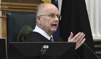 Circuit Court Judge Bruce Schroeder addresses the jury pool at the start of jury selection on the first day of trial for Kyle Rittenhouse in Kenosha, Wis., Circuit Court Monday Nov. 1, 2021.   Rittenhouse is accused of killing two people and wounding a third during a protest over police brutality in Kenosha, last year. (Mark Hertzberg/Pool Photo via AP)