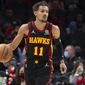 Atlanta Hawks Trae Young (11)  moves the ball during the first half of an NBA basketball game against the Washington Wizards on Monday, Nov. 1, 2021, in Atlanta. (AP Photo/Hakim Wright Sr.)