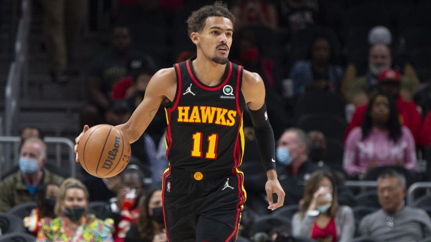 Atlanta Hawks Trae Young (11)  moves the ball during the first half of an NBA basketball game against the Washington Wizards on Monday, Nov. 1, 2021, in Atlanta. (AP Photo/Hakim Wright Sr.)
