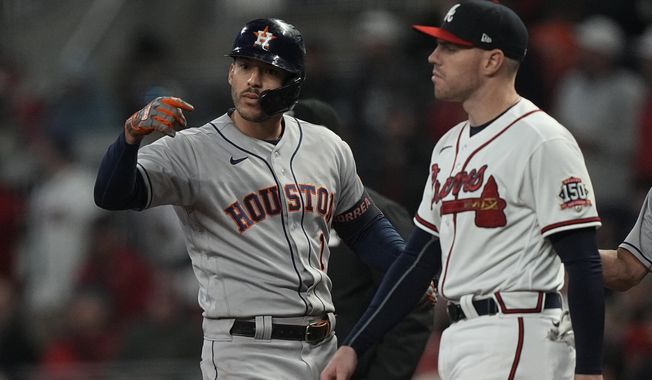 Houston Astros&#x27; Carlos Correa celebrates his RBI single during the eighth inning in Game 5 of baseball&#x27;s World Series between the Houston Astros and the Atlanta Braves Sunday, Oct. 31, 2021, in Atlanta. (AP Photo/David J. Phillip)