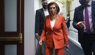 Speaker of the House Nancy Pelosi, D-Calif., arrives to meet with the Democratic Caucus at the Capitol in Washington, early Tuesday, Nov. 2, 2021. Even as Sen. Joe Manchin, D-W.Va., is wavering over supporting President Joe Biden&#39;s $1.75 trillion domestic policy package, Democratic leaders are vowing to push ahead, with voting possible on the bill this week. (AP Photo/J. Scott Applewhite)