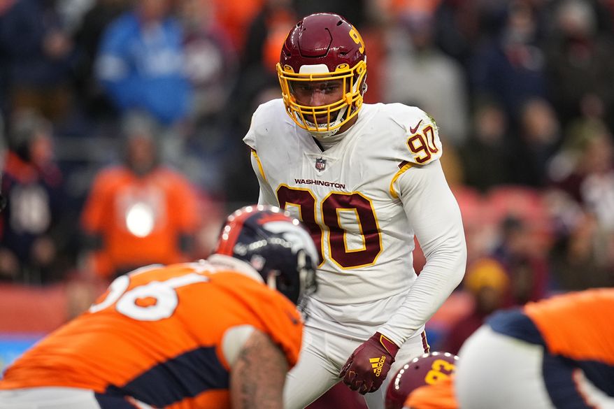 Washington Football Team defensive end Montez Sweat (90) lines up against the Denver Broncos during an NFL football game Sunday, Oct. 31, 2021, in Denver. (AP Photo/Jack Dempsey)