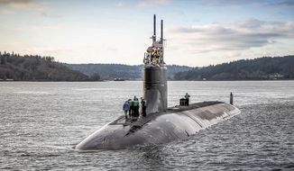 The Seawolf-class attack submarine USS Connecticut (SSN 22) departs Puget Sound Naval Shipyard for sea trials following a maintenance availability, Dec. 15, 2016, in Washington. (Thiep Van Nguyen II/U.S. Navy via AP)