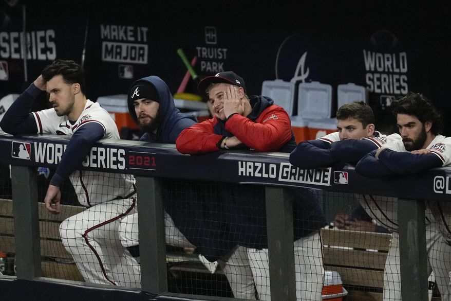Members of the Atlanta Braves watch during the ninth inning in Game 5 of baseball&#39;s World Series between the Houston Astros and the Atlanta Braves Monday, Nov. 1, 2021, in Atlanta. The Astros won 9-5. The Braves lead the series 3-2 games. (AP Photo/Ashley Landis) **FILE**