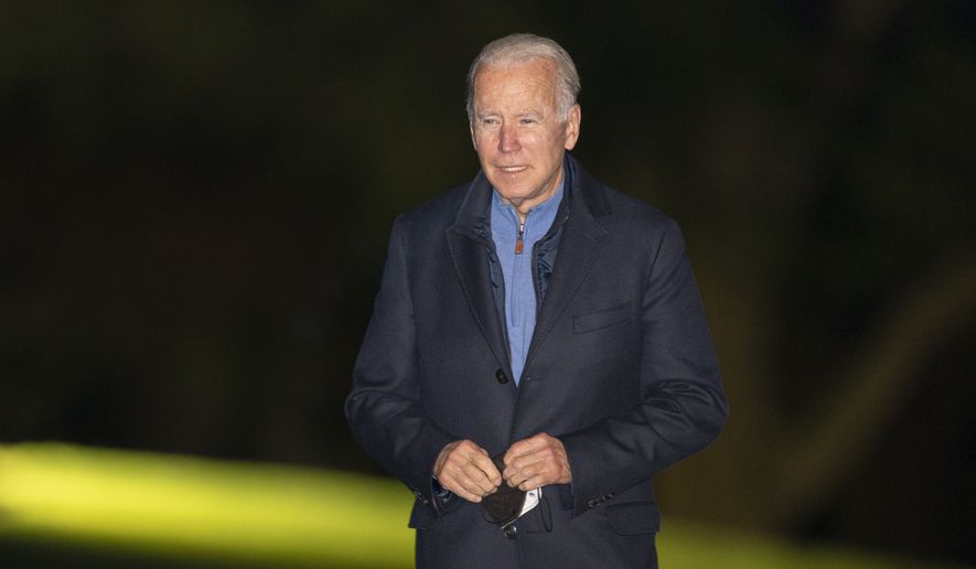 President Joe Biden walks on the South Lawn as he arrives at the White House early Wednesday, Nov. 3, 2021 in Washington from a European trip. (AP Photo/Manuel Balce Ceneta)