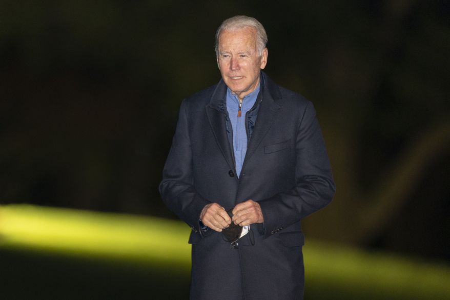President Joe Biden walks on the South Lawn as he arrives at the White House early Wednesday, Nov. 3, 2021 in Washington from a European trip. (AP Photo/Manuel Balce Ceneta)