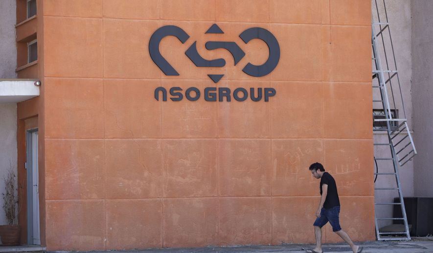 A logo adorns a wall on a branch of the Israeli NSO Group company, near the southern Israeli town of Sapir, Tuesday, Aug. 24, 2021. The Biden administration announced Wednesday, Nov. 3, 2021, it is putting new export limits on two Israeli hacker-for-hire companies including the well-known spyware company NSO Group saying their tools have been used to &quot;conduct transnational repression.&quot; (AP Photo/Sebastian Scheiner, File)