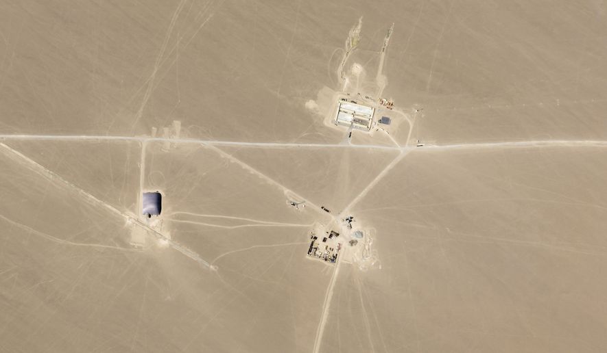 This July 25, 2021, satellite image provided by Planet Labs Inc. shows what analysts believe is construction on an intercontinental ballistic missile silo near Hami, China. The Pentagon says in a report on Wednesday, Nov. 3, China is expanding its nuclear force much faster than U.S. officials predicted just a year ago. In a report to Congress, the Pentagon says this highlights a broad and accelerating expansion of military power designed to enable Beijing to match or surpass American global influence and power by mid-century. (Planet Labs Inc. via AP) **FILE**