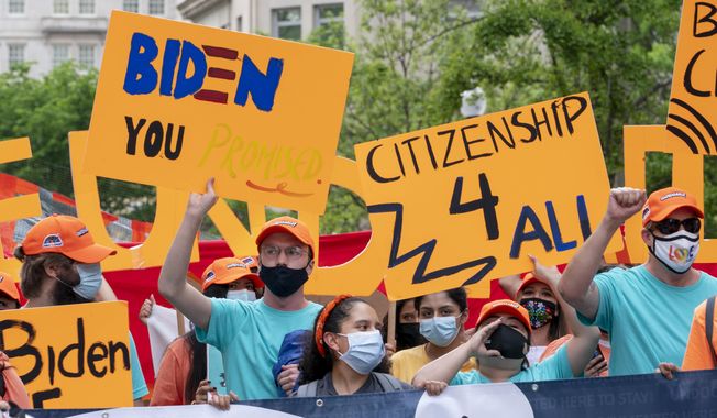 Supporters of immigration reform march while asking for a path to citizenship and an end to detentions and deportations, April 28, 2021, in Washington. Biden took office on Jan. 20 and almost immediately, numbers of migrants exceeded expectations. (AP Photo/Jacquelyn Martin) **FILE**