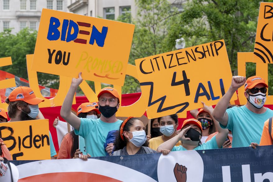 Supporters of immigration reform march while asking for a path to citizenship and an end to detentions and deportations, April 28, 2021, in Washington. Biden took office on Jan. 20 and almost immediately, numbers of migrants exceeded expectations. (AP Photo/Jacquelyn Martin) **FILE**