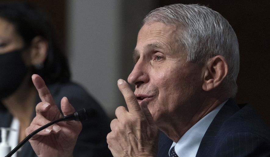 Dr. Anthony Fauci, right, director of the National Institute of Allergy and Infectious Diseases, speaks during a Senate Health, Education, Labor, and Pensions Committee hearing on Capitol Hill, Thursday, Nov. 4, 2021, in Washington. (AP Photo/Alex Brandon)