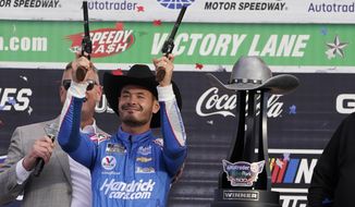 Kyle Larson (5) celebrates after winning a NASCAR Cup Series auto race at Texas Motor Speedway Sunday, Oct. 17, 2021, in Fort Worth, Texas. (AP Photo/Larry Papke) **FILE**
