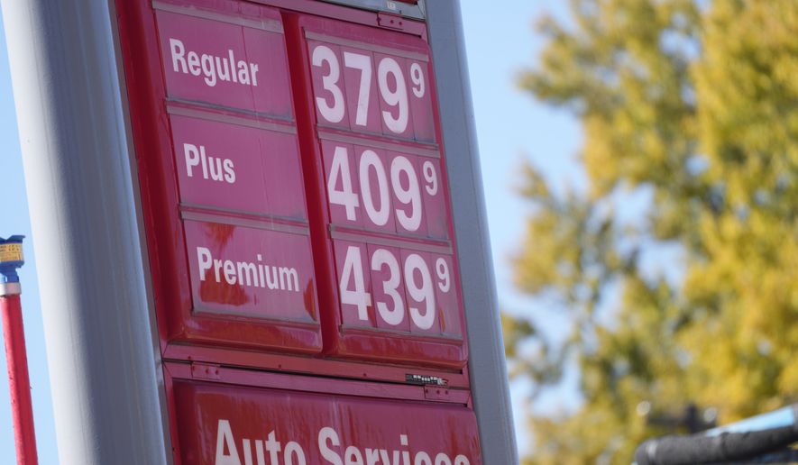 The prices for grades of gasoline are shown on a sign outside a Conoco station Friday, Nov. 5, 2021, in Denver. (AP Photo/David Zalubowski) ** FILE **