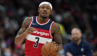 Washington Wizards guard Bradley Beal drives the ball in the second half of an NBA basketball game against the Memphis Grizzlies, Friday, Nov. 5, 2021, in Washington. (AP Photo/Patrick Semansky)