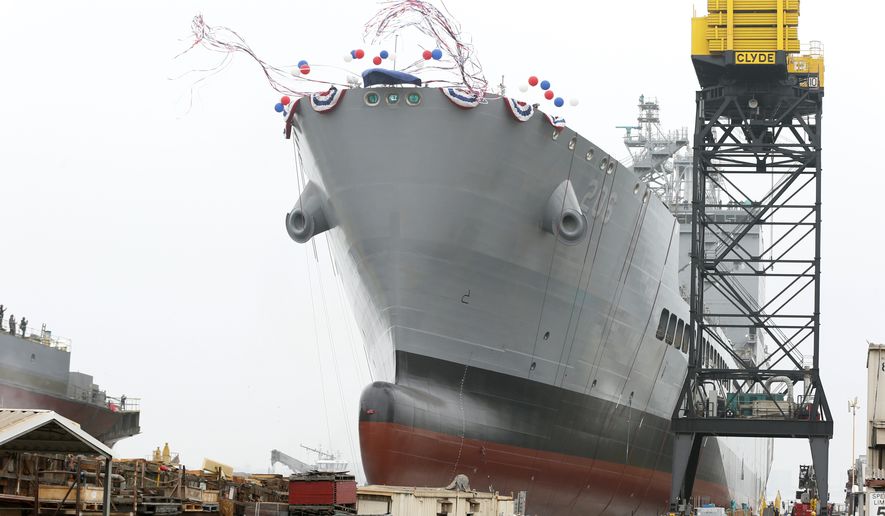 The U.S. Navy launches the USNS Harvey Milk, a fleet replenishment oiler ship named after the first openly gay elected official, in San Diego, Saturday, Nov. 6, 2021. The Navy ship is the second of six vessels in the Navy&#39;s John Lewis-class program, second to the USNS John Lewis. (AP Photo/Alex Gallardo)
