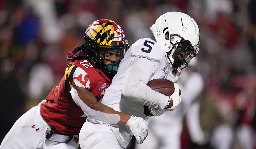 Penn State wide receiver Jahan Dotson, right, is tackled by Maryland defensive back Tarheeb Still after making a catch during the second half of an NCAA college football game, Saturday, Nov. 6, 2021, in College Park, Md. Penn State won 31-14. (AP Photo/Julio Cortez)