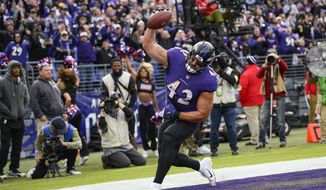 Baltimore Ravens fullback Patrick Ricard (42) celebrates his touchdown during the second half of an NFL football game against the Minnesota Vikings, Sunday, Nov. 7, 2021, in Baltimore. (AP Photo/Nick Wass)