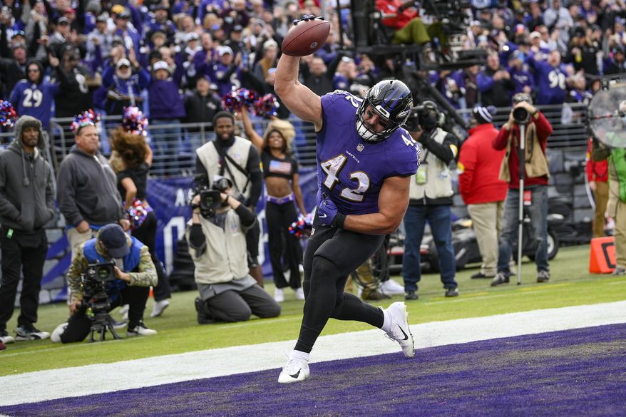Baltimore Ravens fullback Patrick Ricard (42) celebrates his touchdown during the second half of an NFL football game against the Minnesota Vikings, Sunday, Nov. 7, 2021, in Baltimore. (AP Photo/Nick Wass)